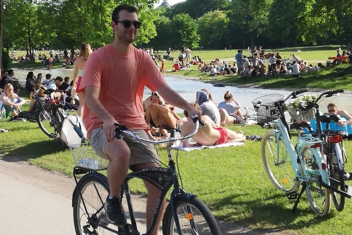 a person riding on the back of a bicycle